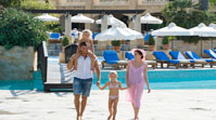 ../images/elysium/pools-gardens&beach/070_Family_at_pool_door_bridge.jpg
